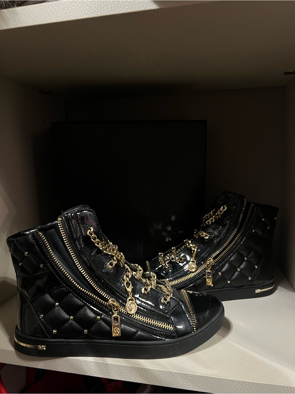 Michael Kors Black Quilted High-Top Sneakers with Gold Hardware